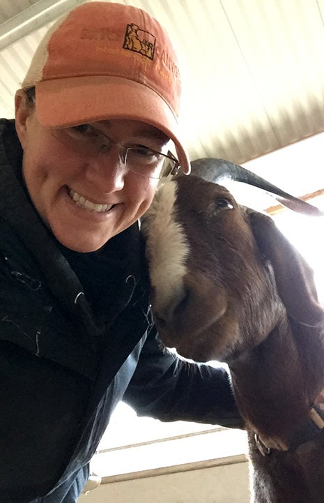 Caregiver Monica with Stevie the goat