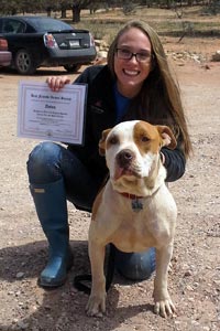 Anton the dog gets his diploma for passing his training
