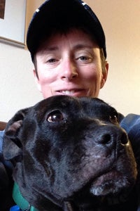 Volunteer Laura's selfie with Lordes, a big black dog