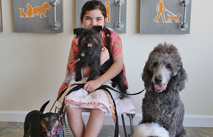 Eden with her adopted dogs, including Stormy