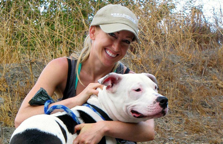 Volunteer Victoria Vertuga on an outing with a pit bull terrier