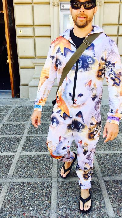 Catman Joe Perry wearing a onesie outfit covered in pictures of cats