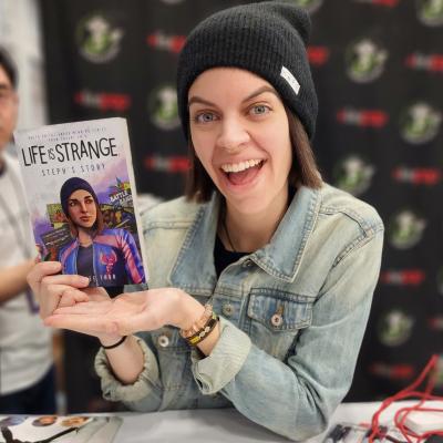 Katy Bentz holding the "Life is Strange" video game