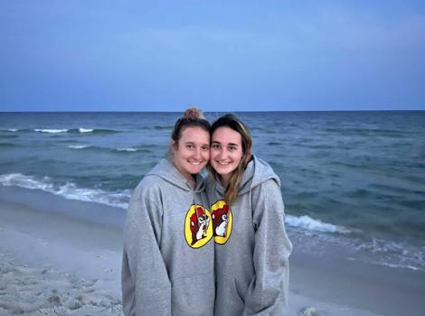 Foster volunteers Lauren Burgess and Jill Church together on a beach