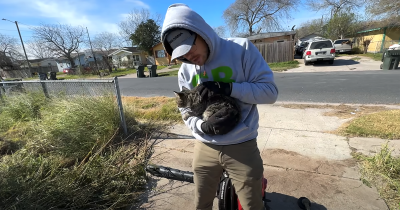Spencer holding a cat