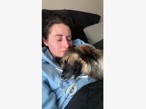 Mackenzie Wilhite sleeping with Nikki the dog on her chest
