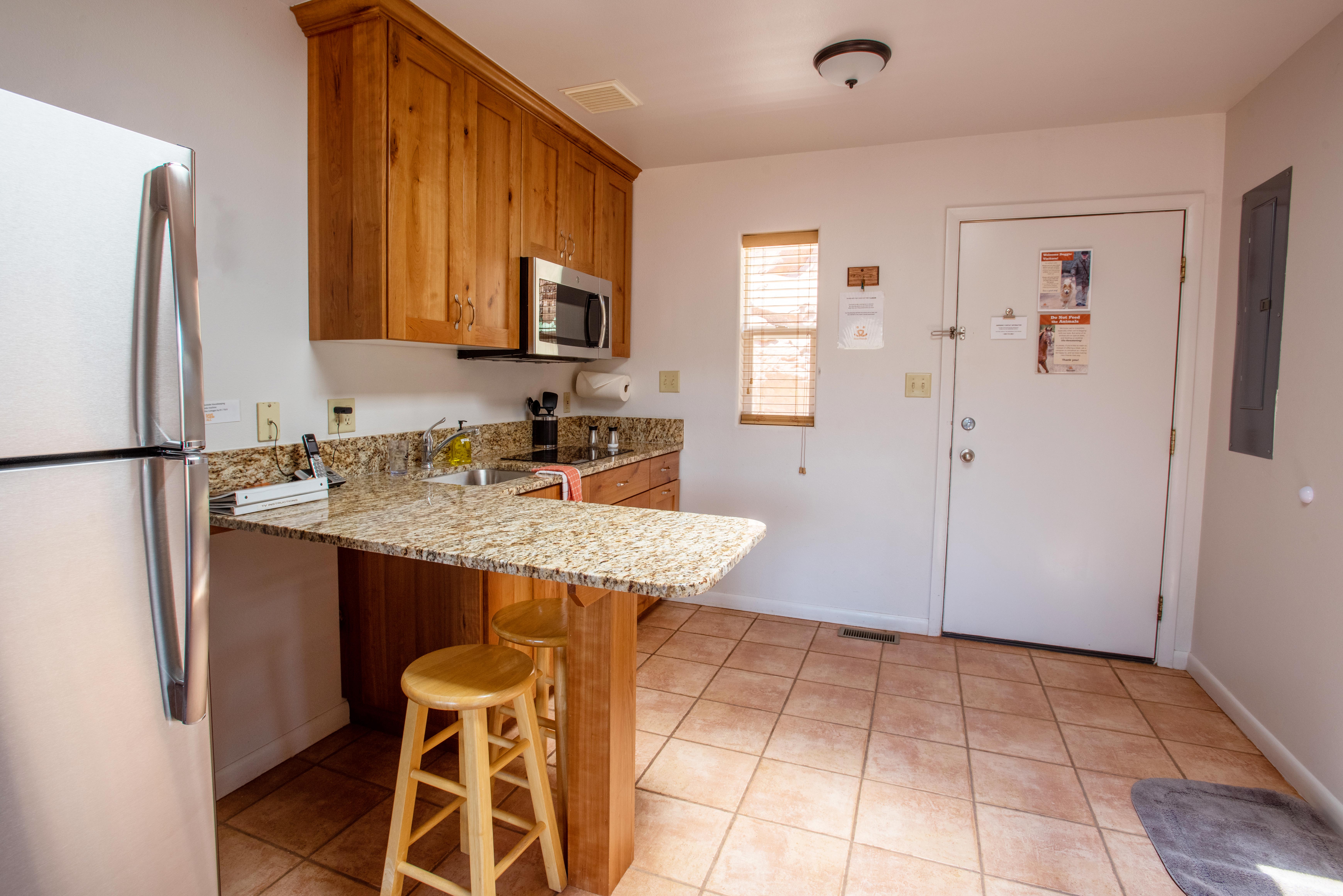 The living area in a Best Friends cottage, looking toward the front door past the kitchen