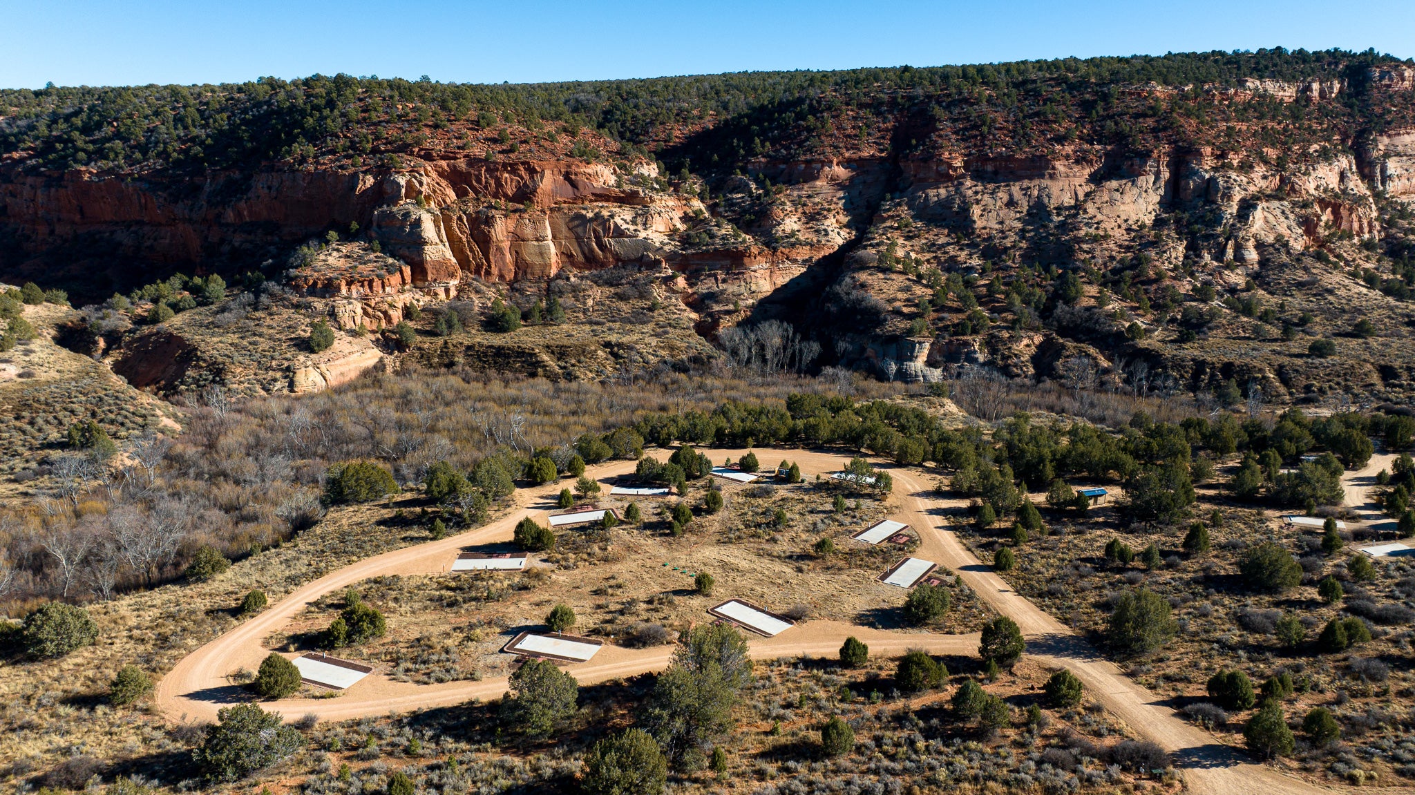 Overhead view of the RV sites at Best Friends Animal Sanctuary with cliffs in the background