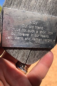 Engraving on wind chime memorial for Arby the dog