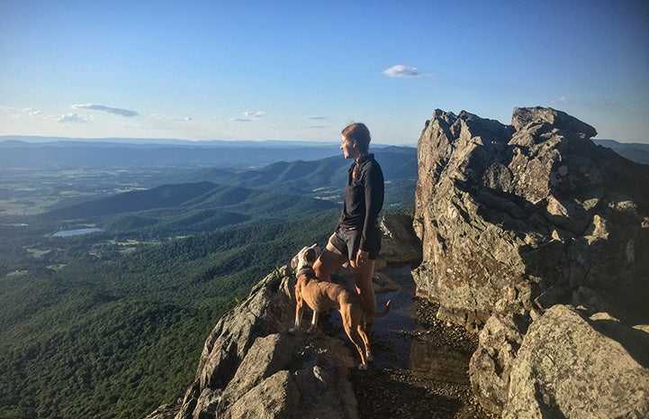 Stretch and Melanie standing out on a rock formation