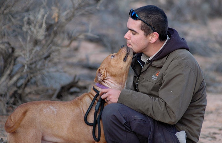 Vicktory dog Meryl licking John Garcia