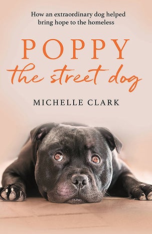 Cover of the book, 'Poppy the street dog: How an extraordinary dog helped give hope to the homeless'