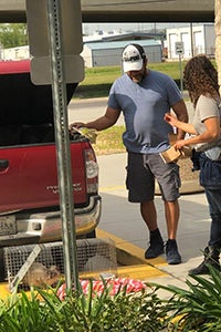 Leah and to Mr. Johnson with a cat in a humane trap