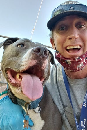 A selfie of Danny and Cannoli the dog out in the yard