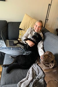 Haley on the couch with Carl and Cassie the dogs