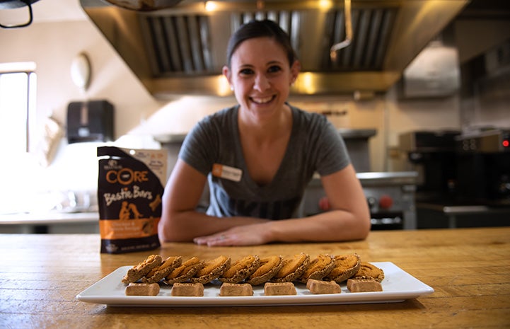 Chef BriAnne in front of Bestie Bar pumpkin pie dog treats