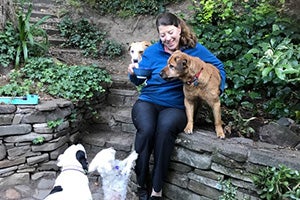 Tammy Hilbrich with Spartacus and her other dogs at home in a garden