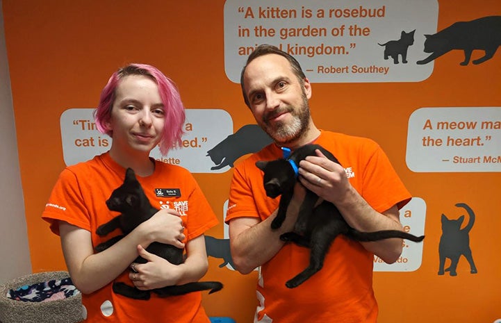Bella and Justin Brodie, volunteers at the Best Friends Lifesaving Center in Salt Lake City, holding black kittens