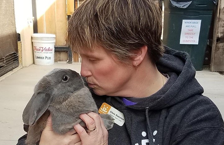 Bunny House team lead Chris leaning in to kiss Nick the rabbit