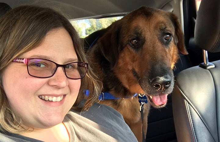 Melanie Nakanishi next to Porter the dog in car for a ride