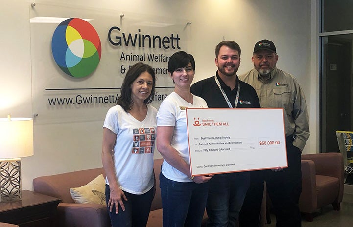 People holding a giant $50,000 check from Best Friends to Gwinnett County Animal Welfare and Enforcement in the Atlanta, Georgia