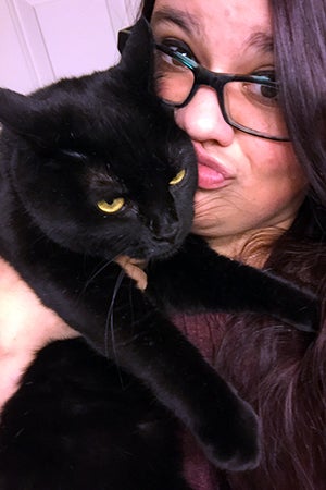 Olivia holding Felicity the black cat