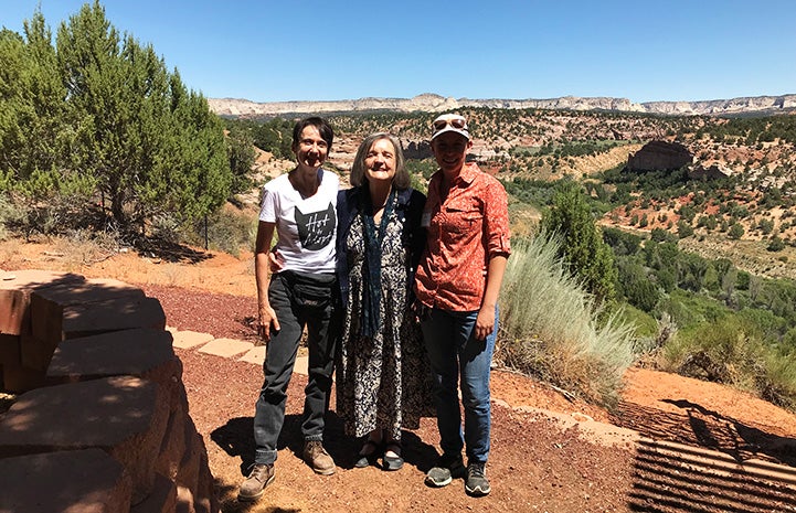 Donna Cerio standing with Faith Maloney and another person in front of Angel Canyon 
