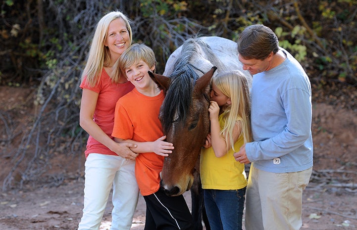 The Scharf family volunteering at Horse Haven in 2012