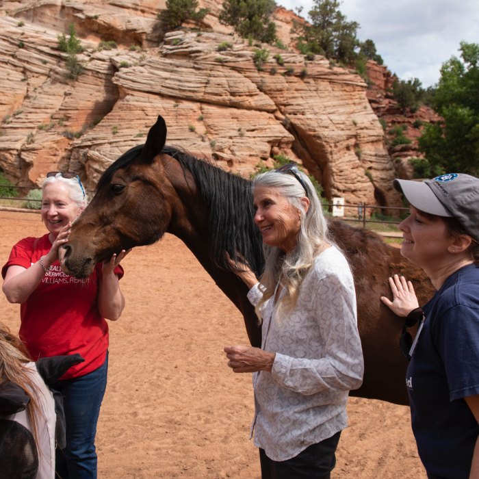 Best Friends founder Jana DePeyer with group at the Sanctuary