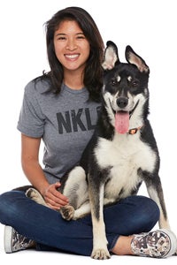 Jane Jetabut sitting with a dog