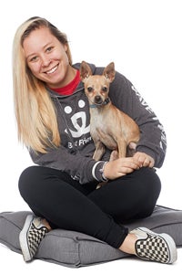 Jessica Schonberg sitting with a dog