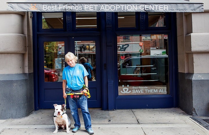 Kathy Posekel and dog in front of Best Friends Lifesaving Center in NYC