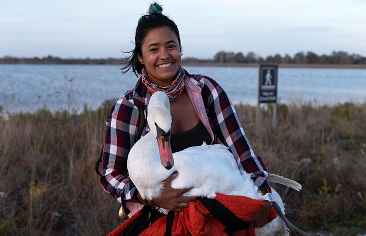 Ariel Cordova-Rojas holding the swan she rescued
