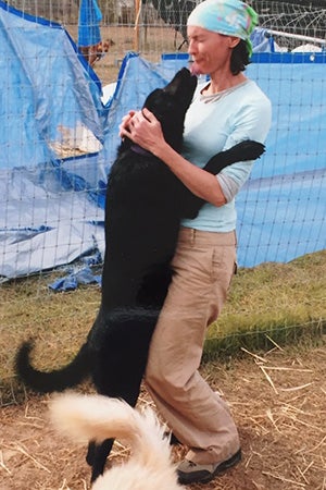 Donna Hampton with Larry the dog in Tylertown after Hurricane Katrina