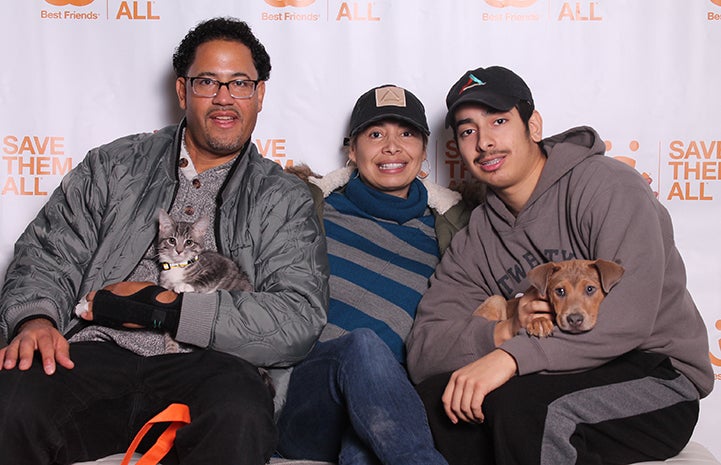 Puppy and kitten being adopted together by a family at the New York Super Adoption