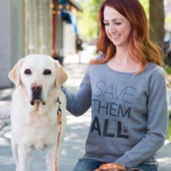 Red haired girl with yellow Labrador retriever