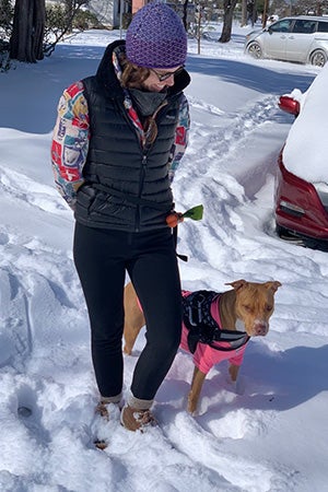 Caitlin Watkins walking Jolene the dog in the snow