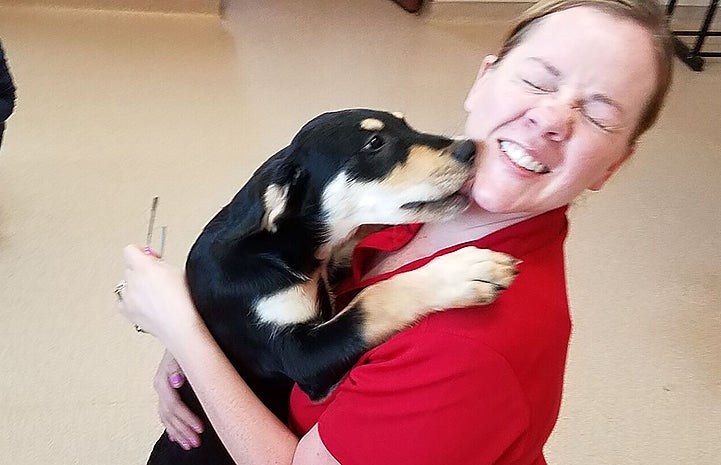 The veterans from Team Red, White & Blue (RWB) got thanks for volunteering with puppy kisses