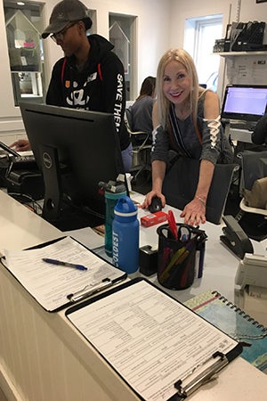 Ruth Temple volunteering as the receptionist at the NKLA Pet Adoption Center
