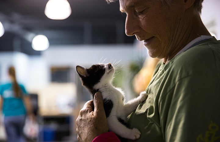 Robin Reddy holding a feline friend