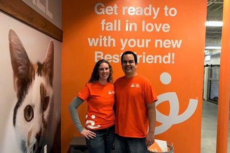 Volunteers Erin and Eric Granados at the Best Friends Pet Adoption Center in Atlanta