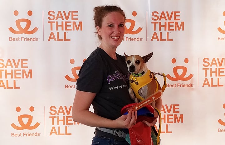 Volunteer Erin Granados holding Dolly Mae the dog from the Best Friends Pet Adoption Center in Atlanta 