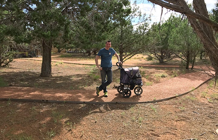 Mike taking a cat on a stroller ride