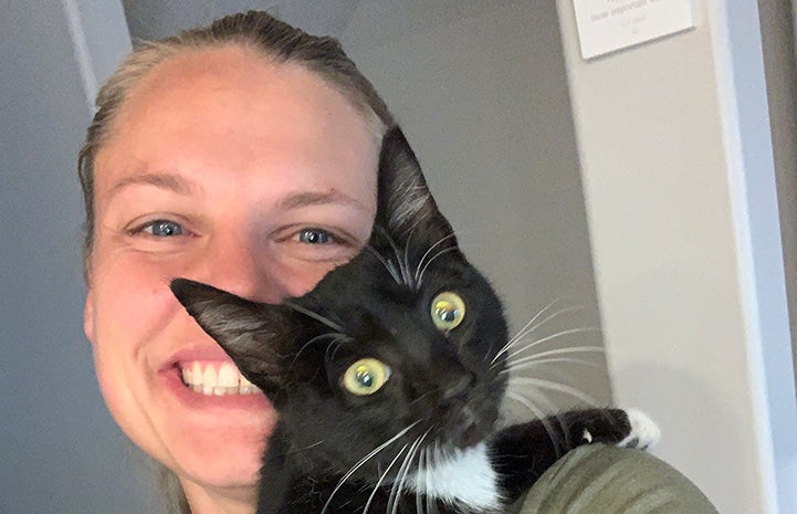 Faleshia holding Athena the black and white kitten