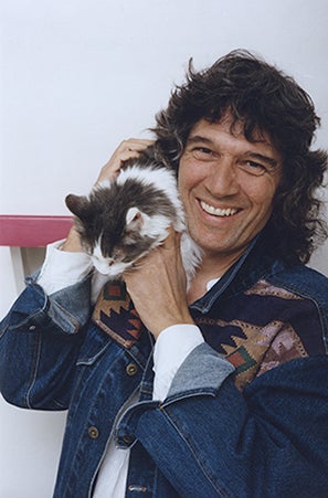 historical image of Cyrus Mejia with a cat