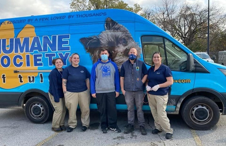 Humane Society of Tulsa van with people standing in front of it