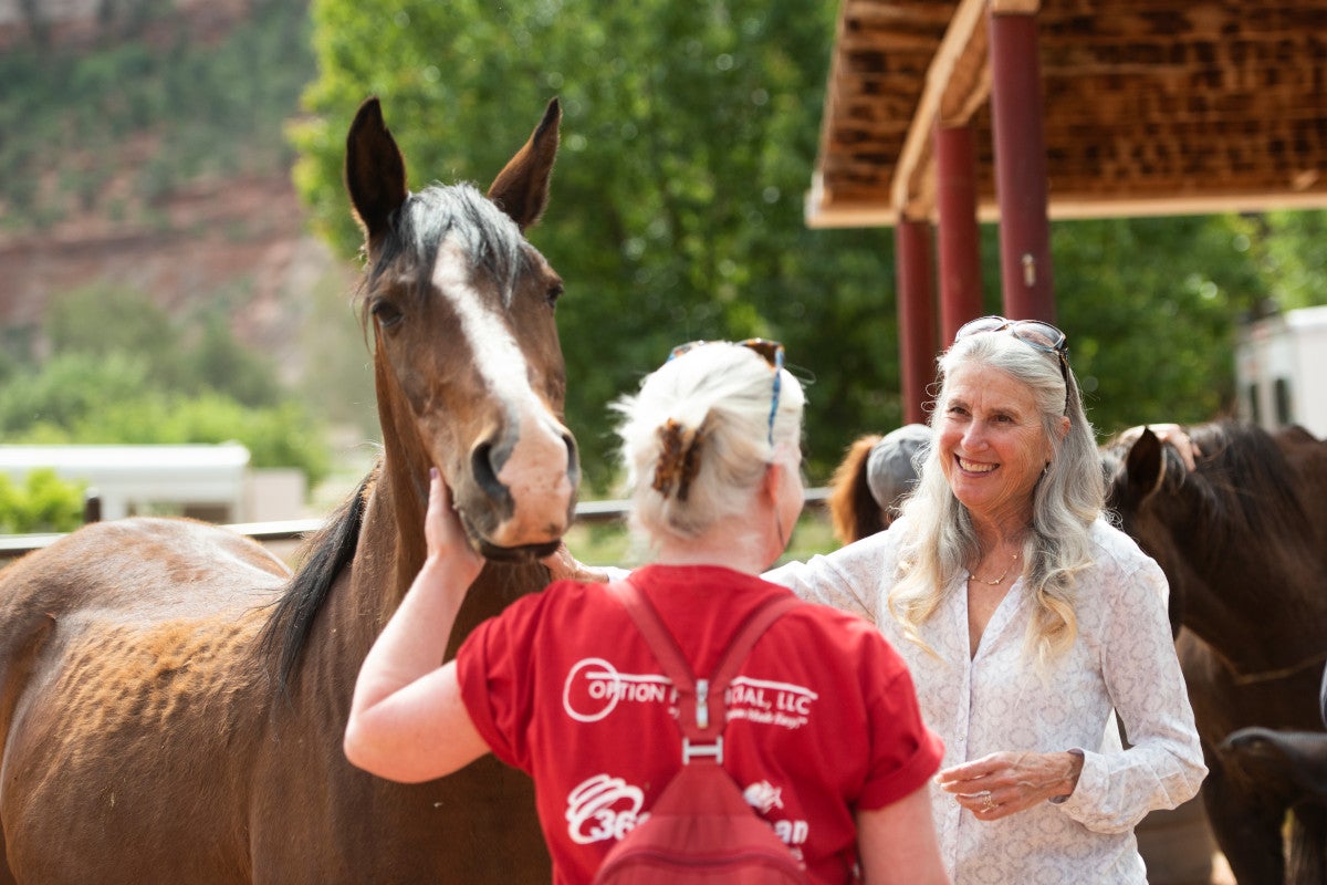 Jana de Peyer with another person in Horse Haven