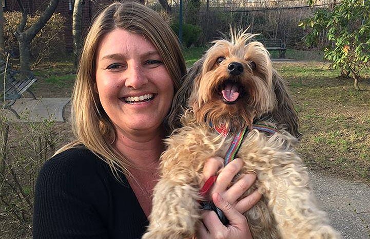 Corinne Conover holding a dog