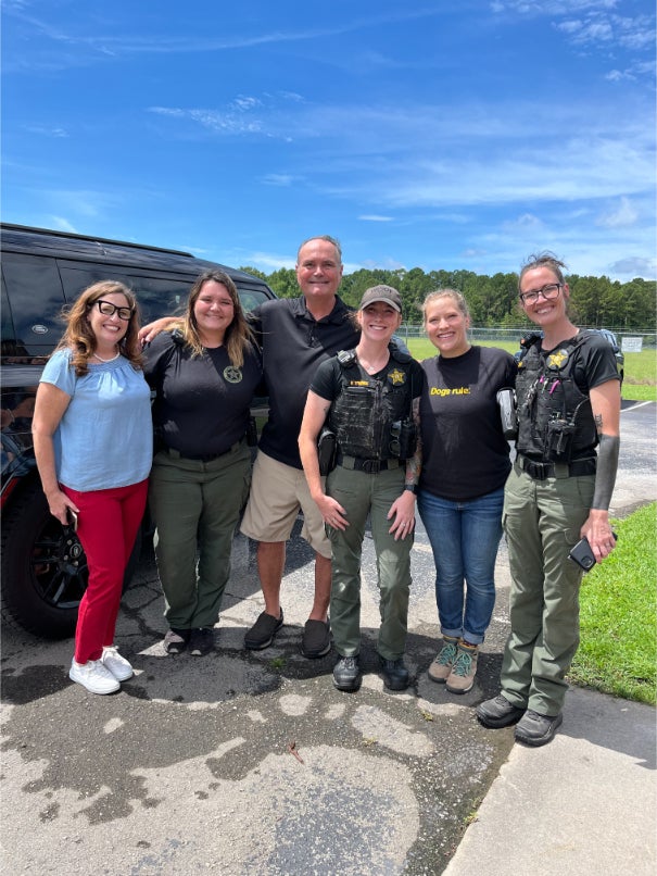 Craven-Pamlico Animal Services Center team posing outside in front of a van.