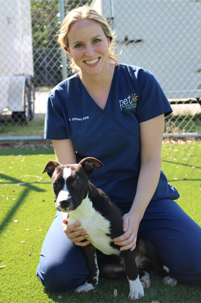 Dr. Offner of Hillsborough County Pet Resource Center with Snoopy the puppy